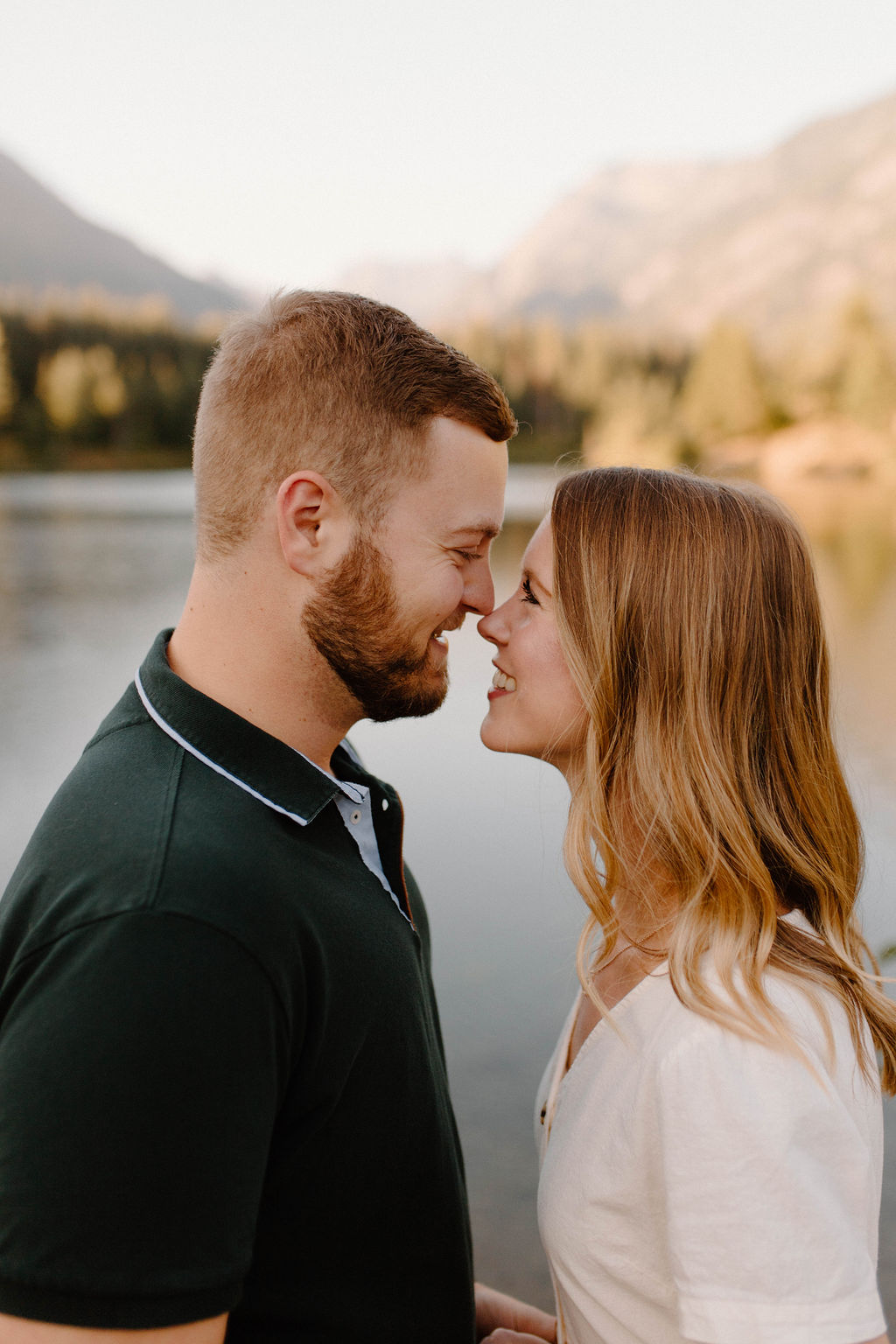Gold Creek Pond Engagement Photos with Pond and mountain backdrops