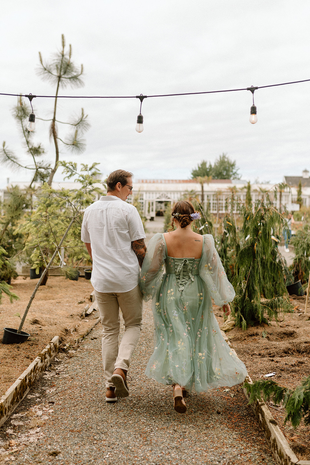 Beautiful bride and groom during their outdoor wedding day with colrful wedding decor and unique wedding reception location