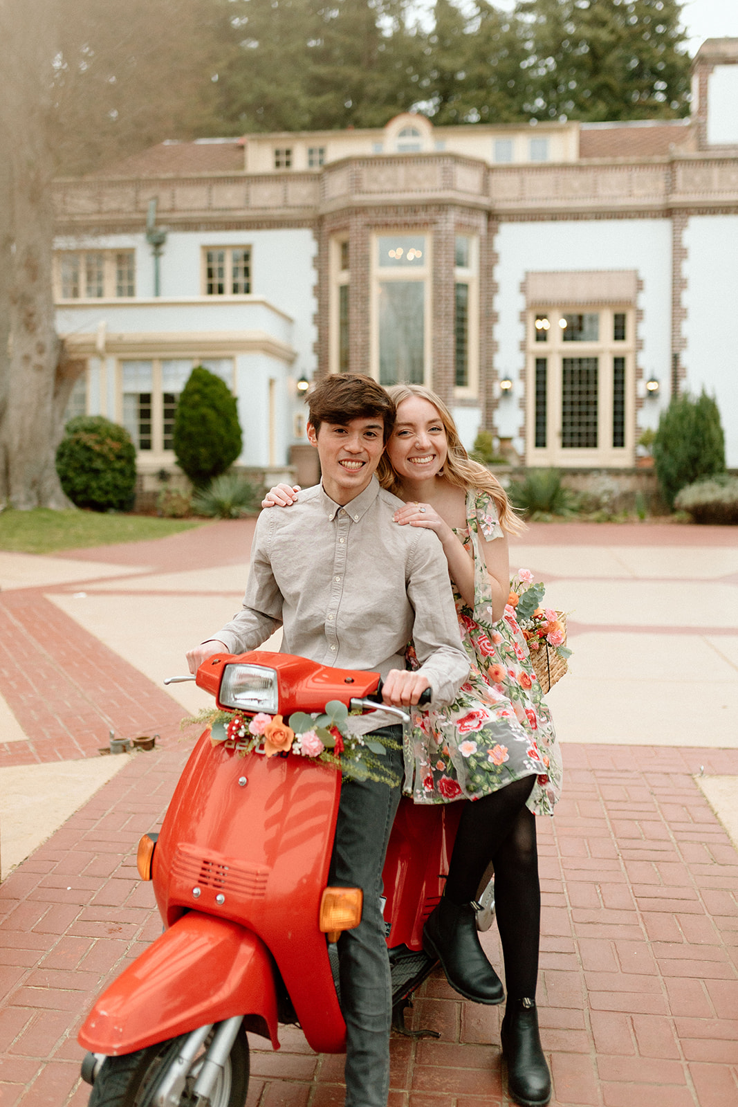 Couple sitting on scooter at Lairmont Manor for their couples photography session