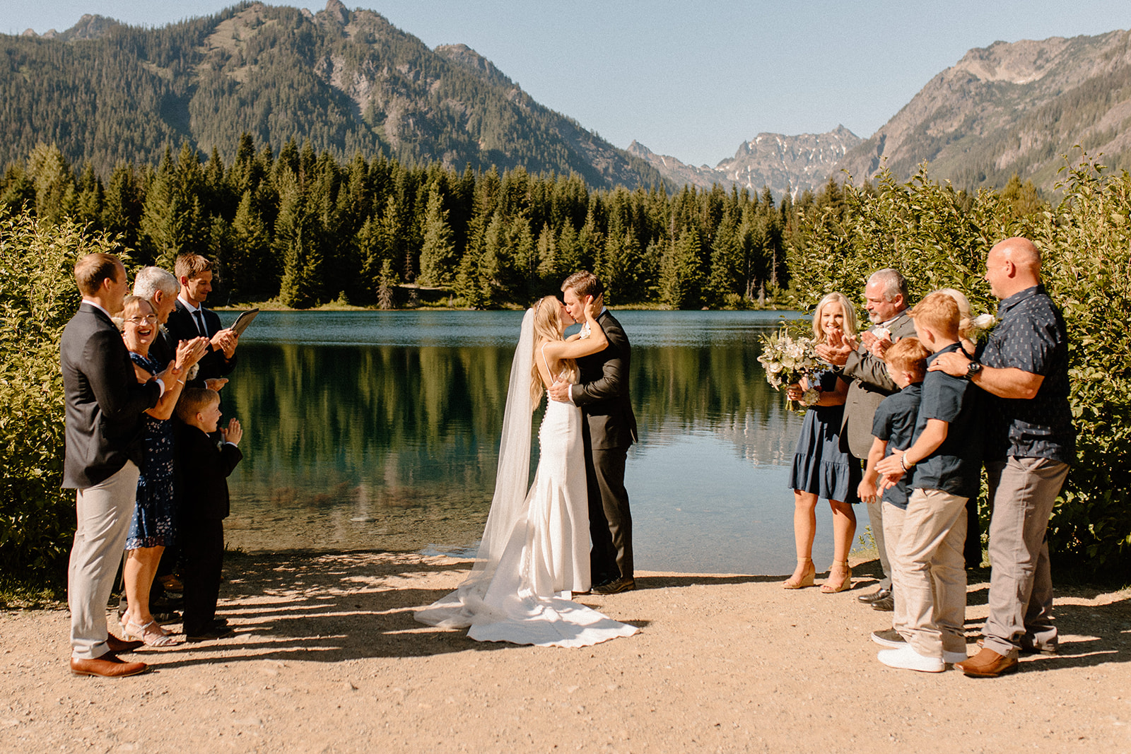 Bride and groom kissing after their gold creek pond elopement ceremony