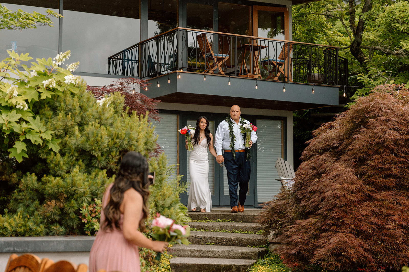 Beautiful bride and groom during their Airbnb elopement experience with outdoor wedding decor and unique wedding reception location