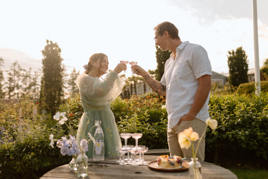 A bride and groom doing a cheers at a garden venue using wedding planning tips