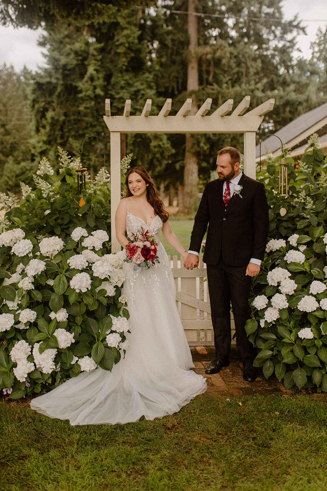 Bride and Groom in Garden for wedding day portraits questions for wedding vendors