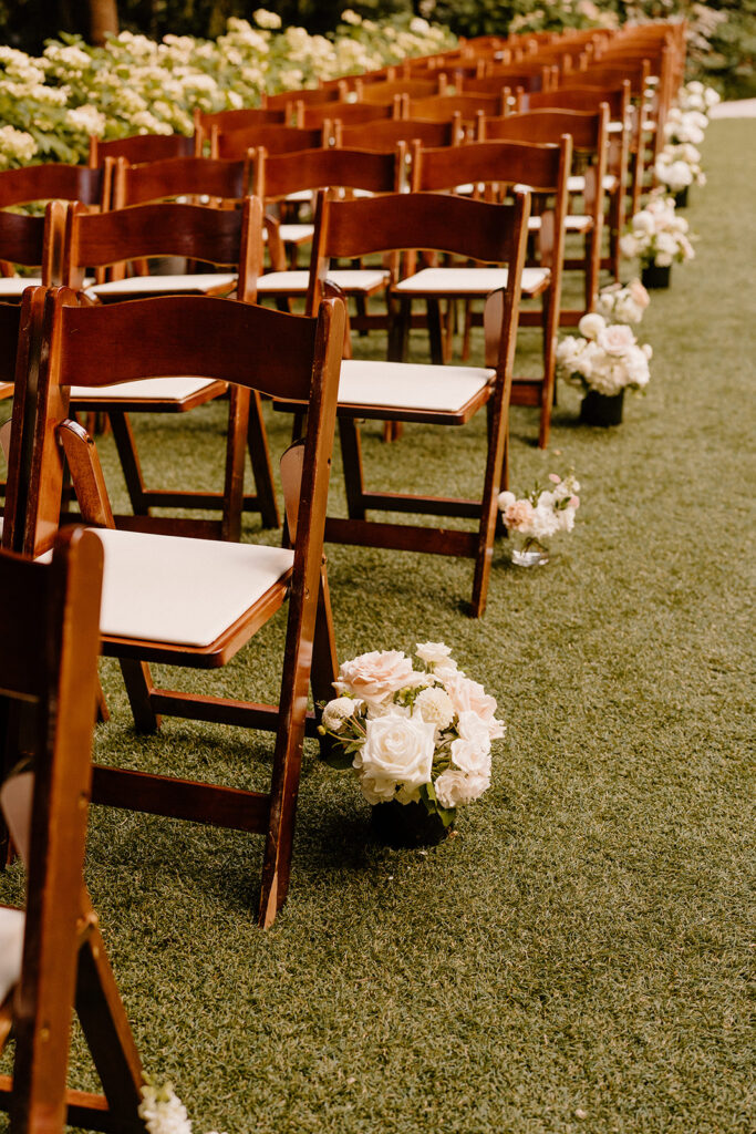 Floral pieces lining the wedding aisle at a winery wedding ceremony
questions to ask wedding vendors 