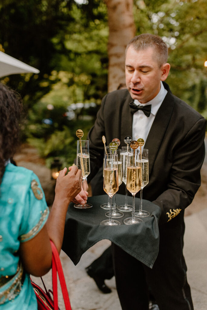 Man serving drinks during cocktail hour at a winery wedding venue
questions to ask wedding vendors 