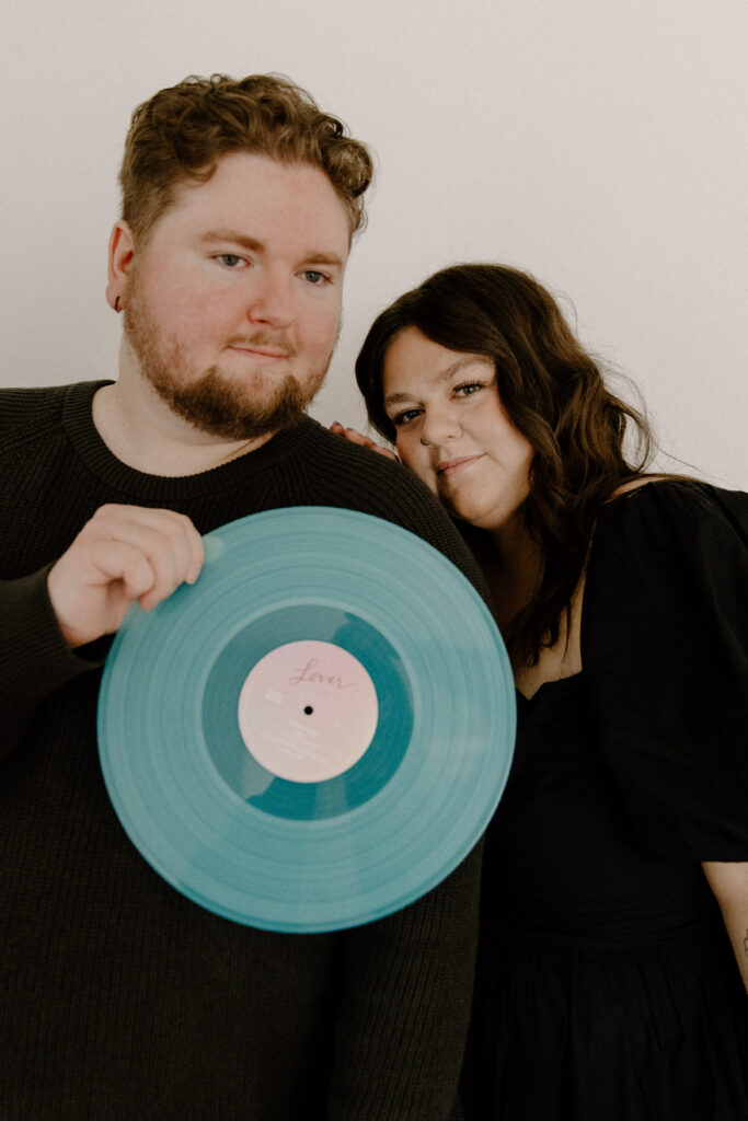 Couple announcing their babies gender with a musical record.