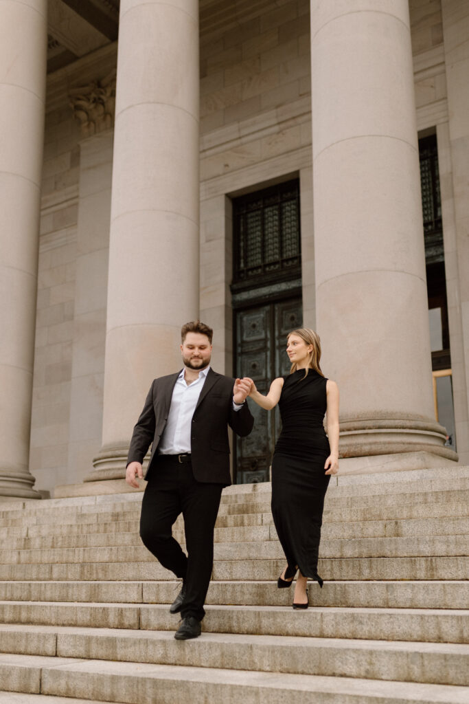 Couple on the steps of the Washington State Capitol Building for their engagement photoshoot.