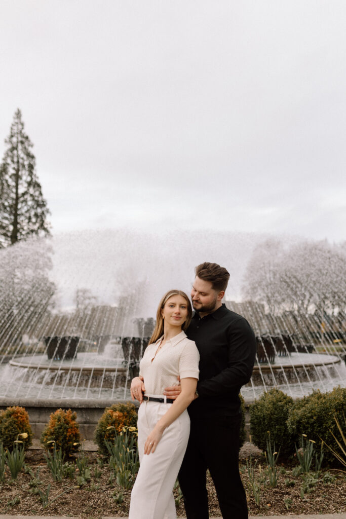 A couple in front of a fountain at the Washington State Capitol building.