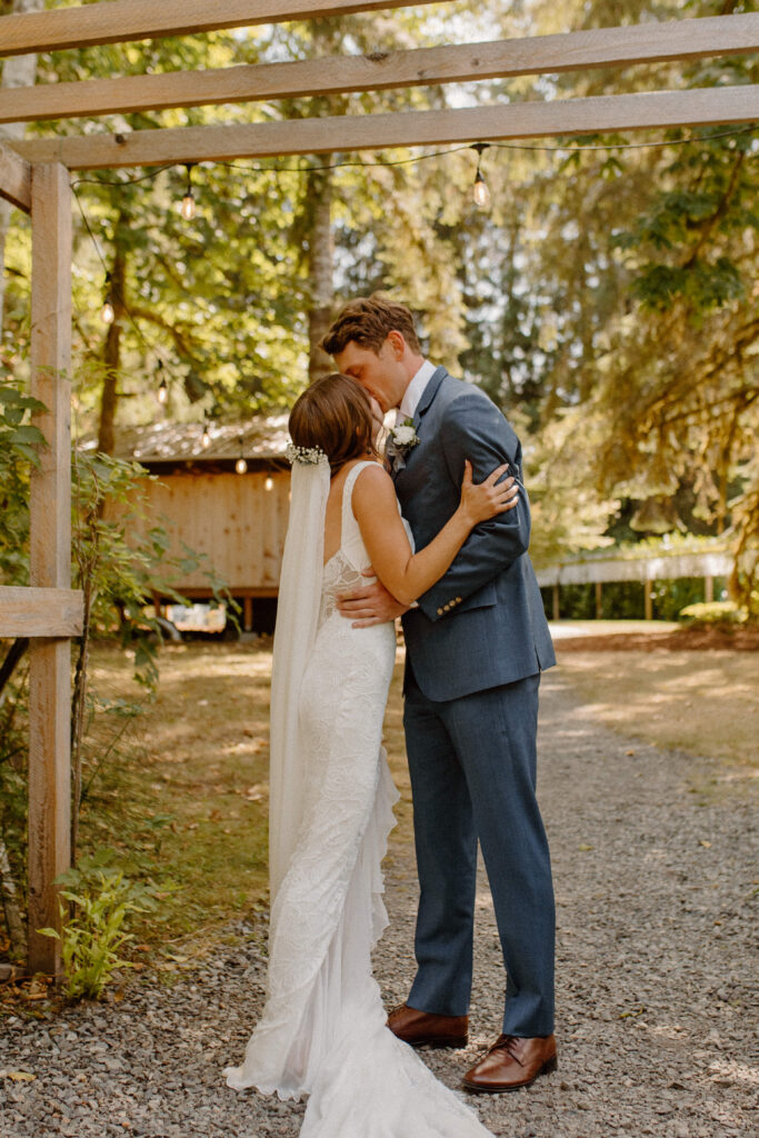 bride and groom first look at river valley oasis wedding venue in granite falls Washington