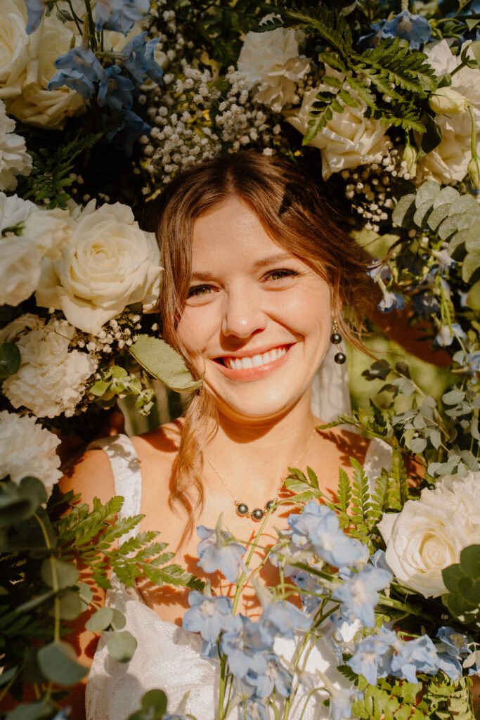 bridal portraits with a flower frame around her