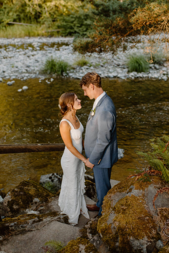 bride and groom portrait by the river