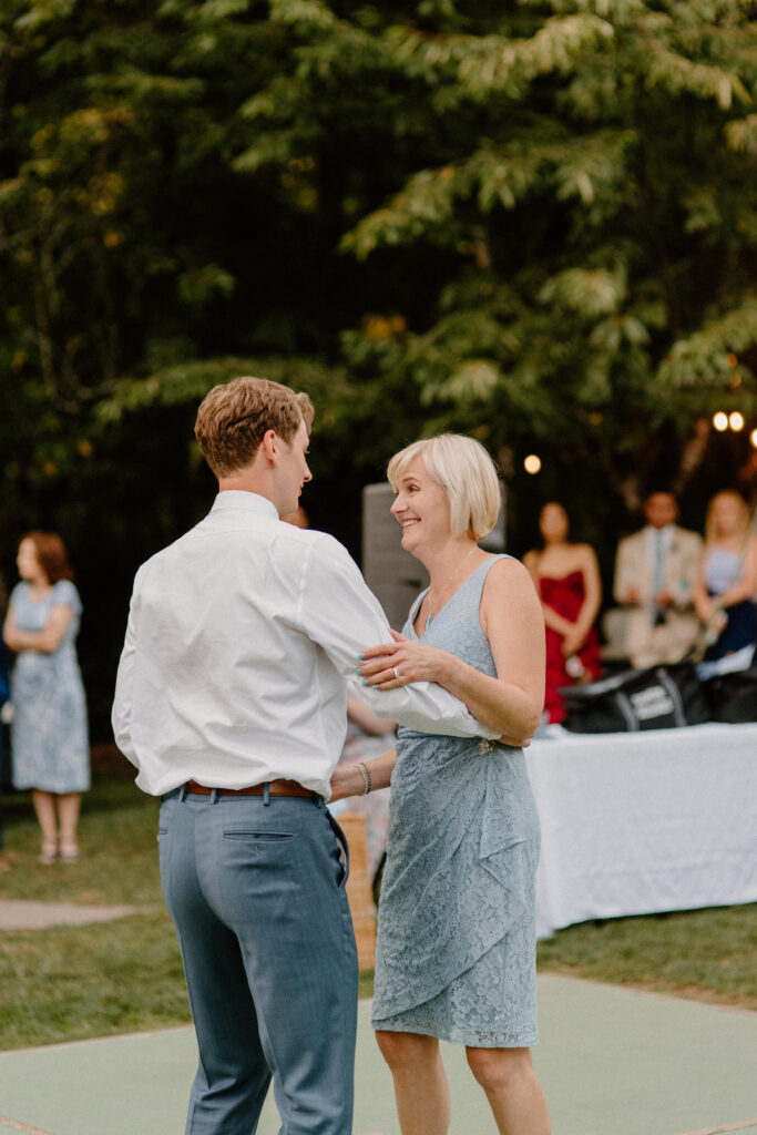 groom dancing with step mom