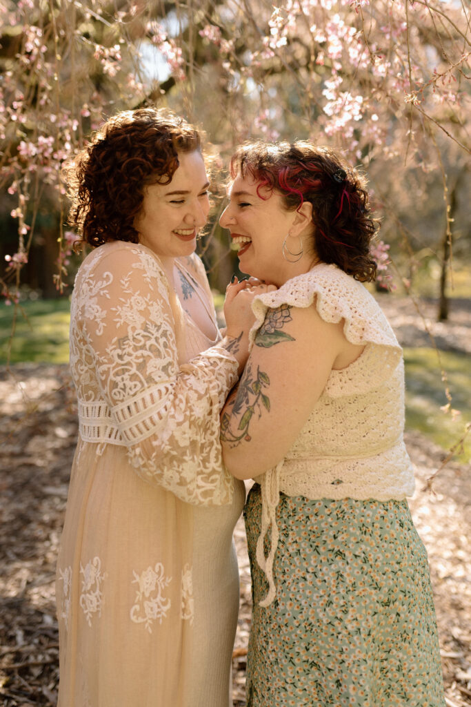 smiling lesbians in engagement photos