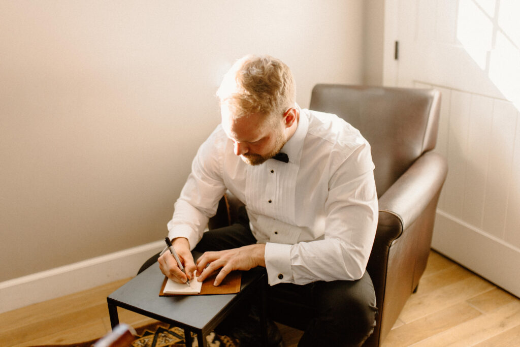 groom writing vows