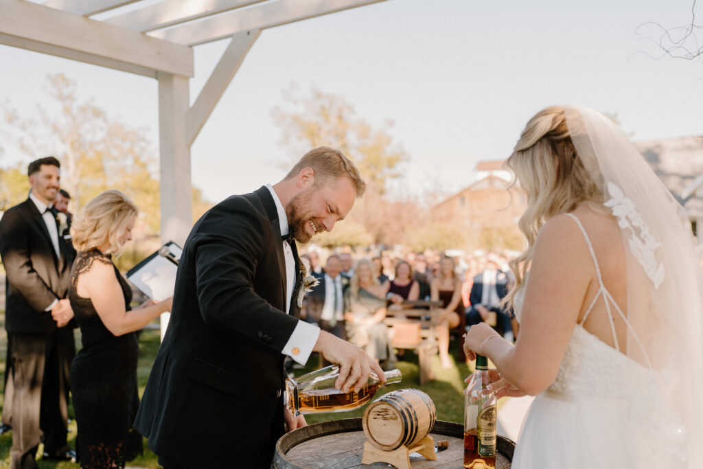 country Colorado wedding bride and groom doing a unity whisky shot