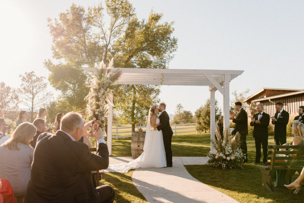 bride and groom first kiss