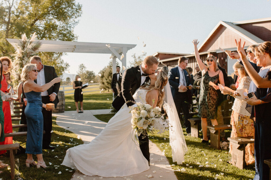 country Colorado wedding bride and groom dip kiss