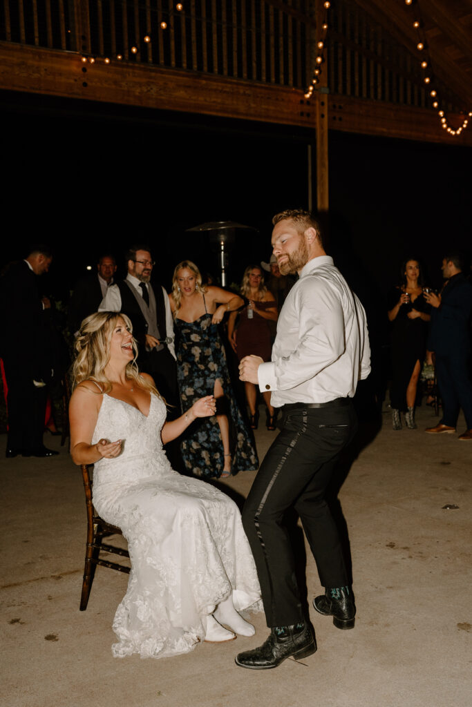 groom dancing for the bride for the gater toss