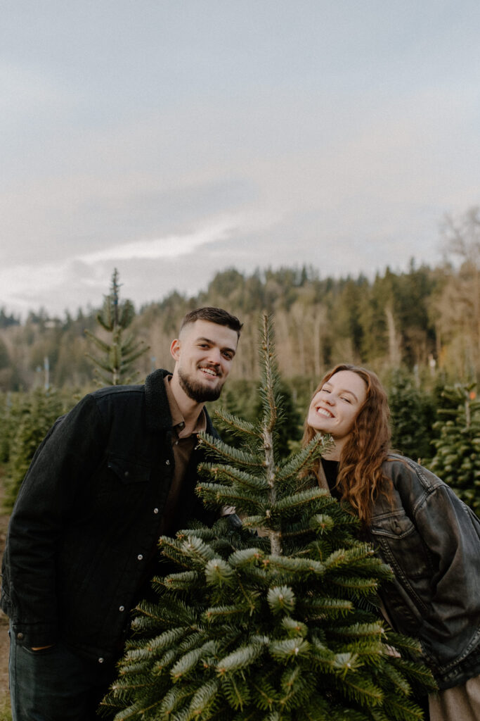 couple having fun at the tree farm