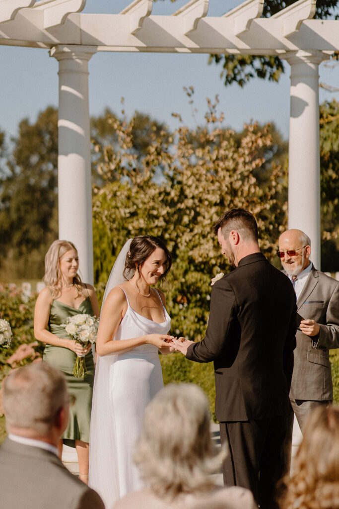 bride and groom exchanging rings