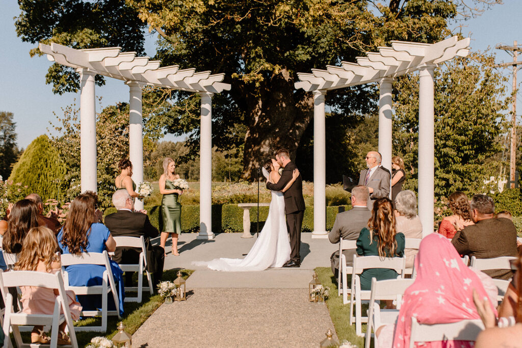 bride and groom first kiss