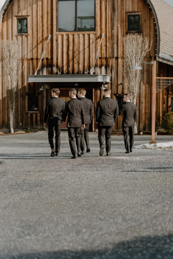 groomsman walking towards the reception site