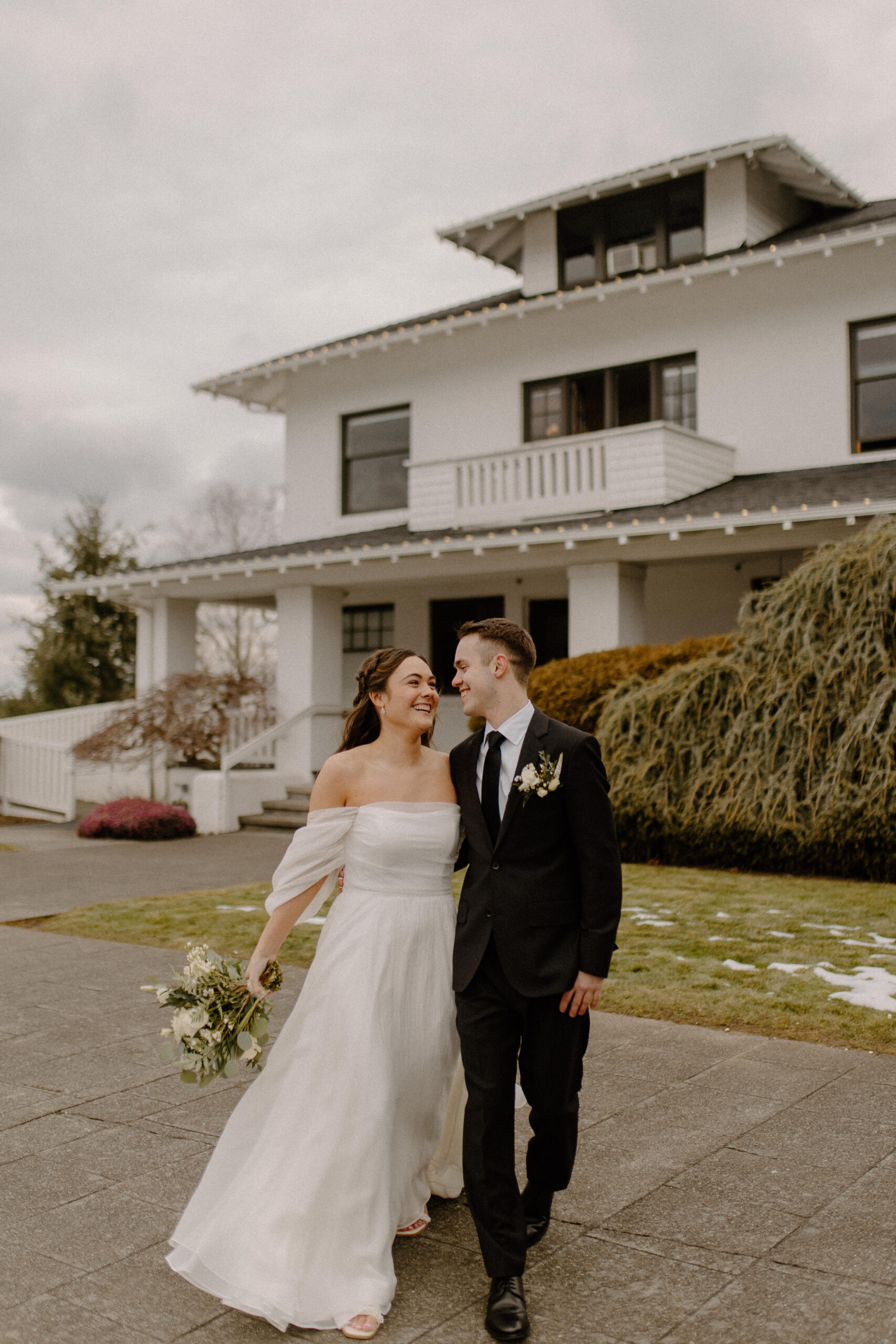 Bride and Groom in front of The Olsen Mansion