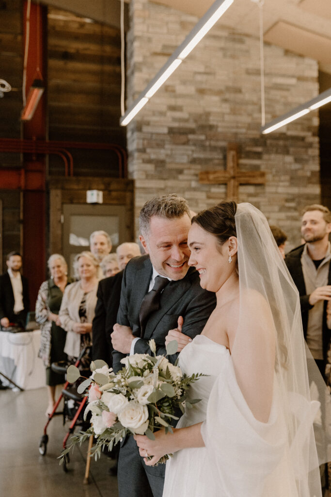 bride walking with father down the aisle 