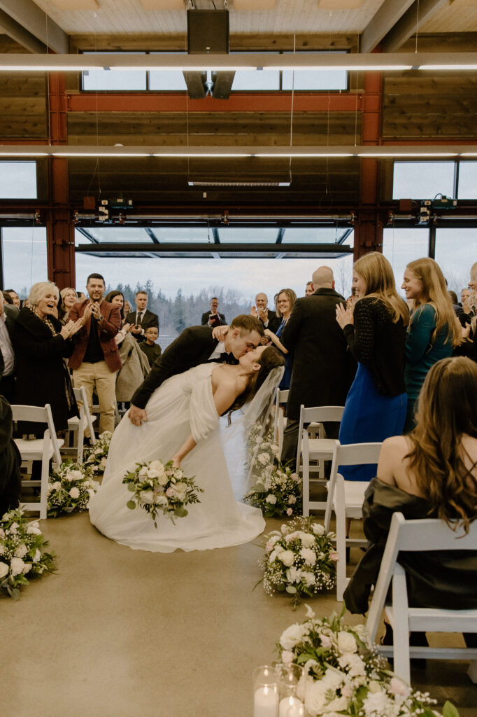 dip kiss at winter wedding ceremony at olsen mansion
