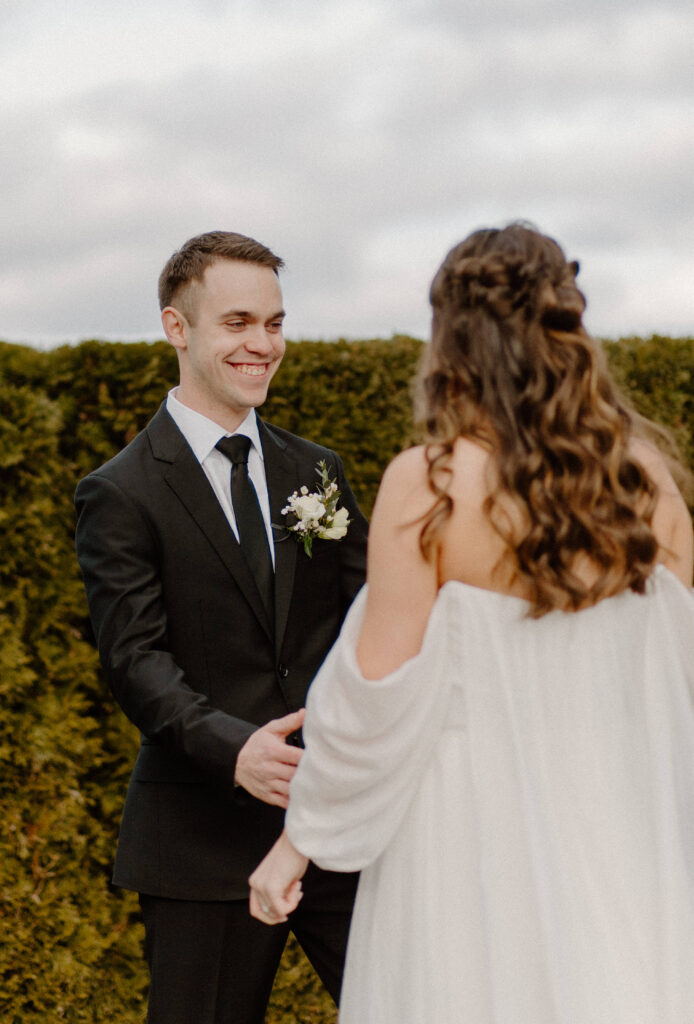 Bride and groom first look at winter wedding