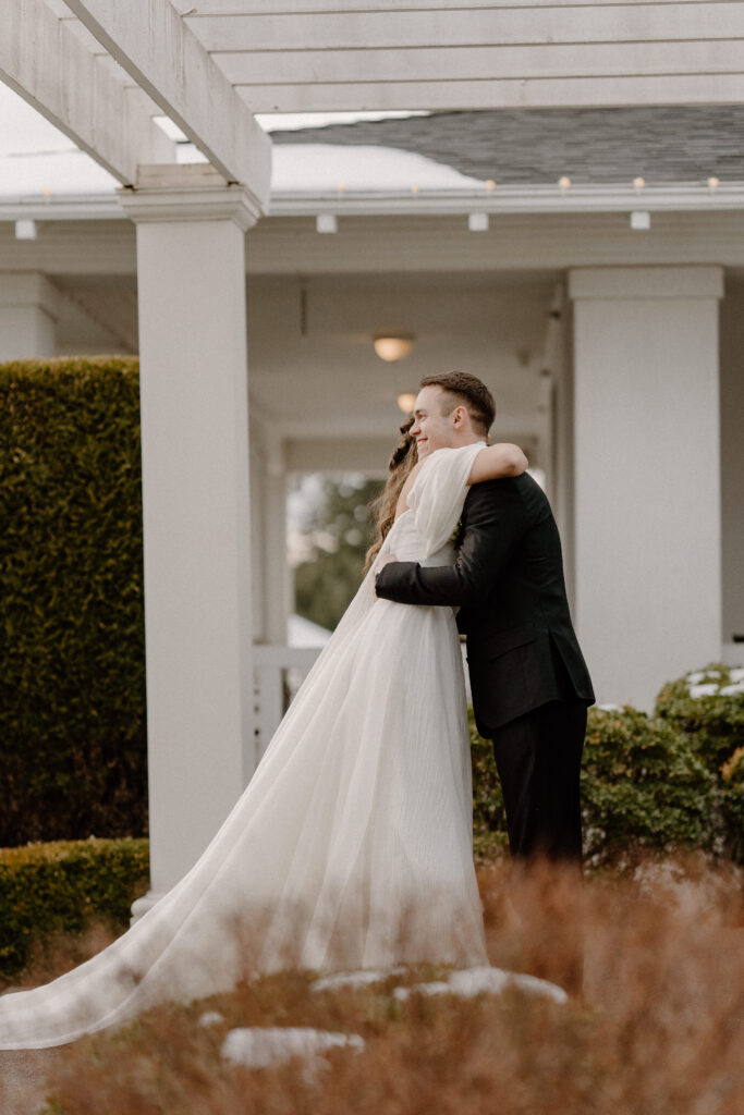 Bride and groom first look at winter wedding