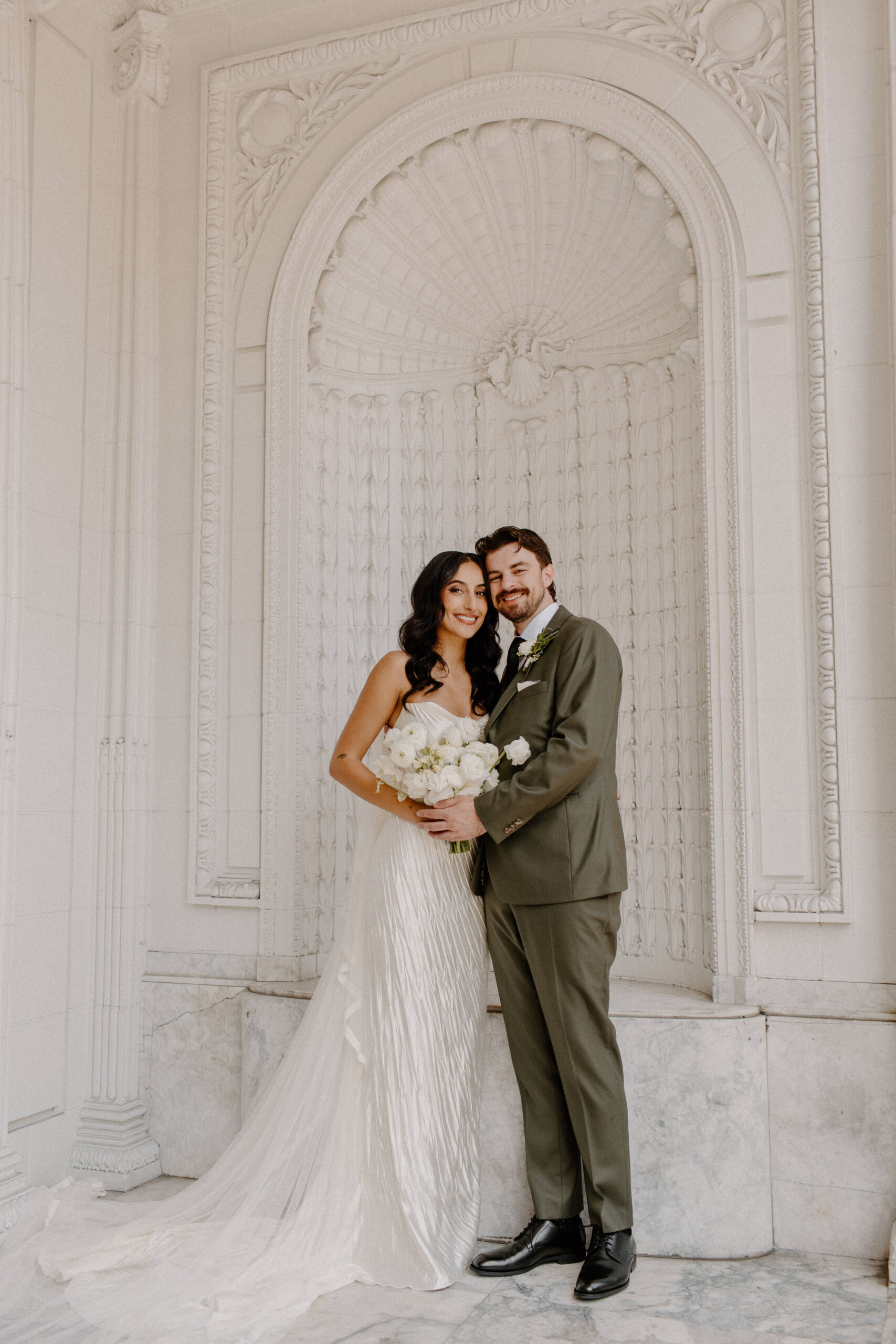 Bride and Groom outside historic hotel
