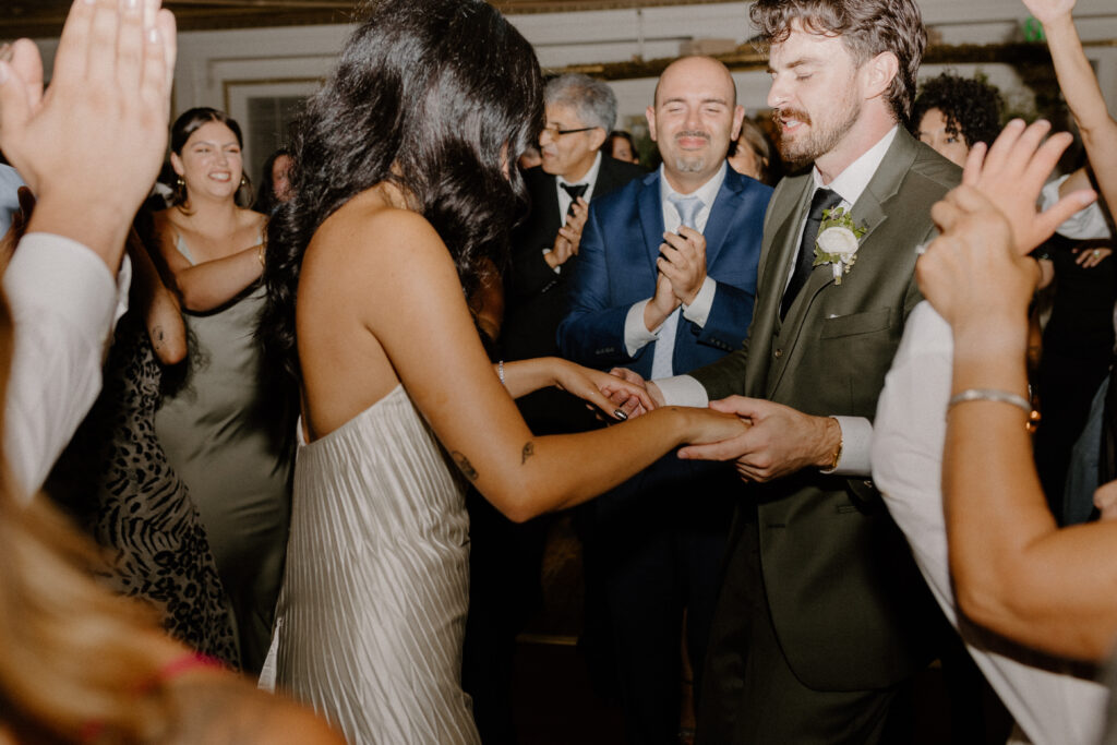 bride and groom dancing in ballroom