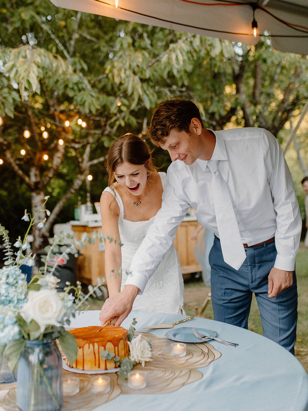 bride and groom cutting the cake