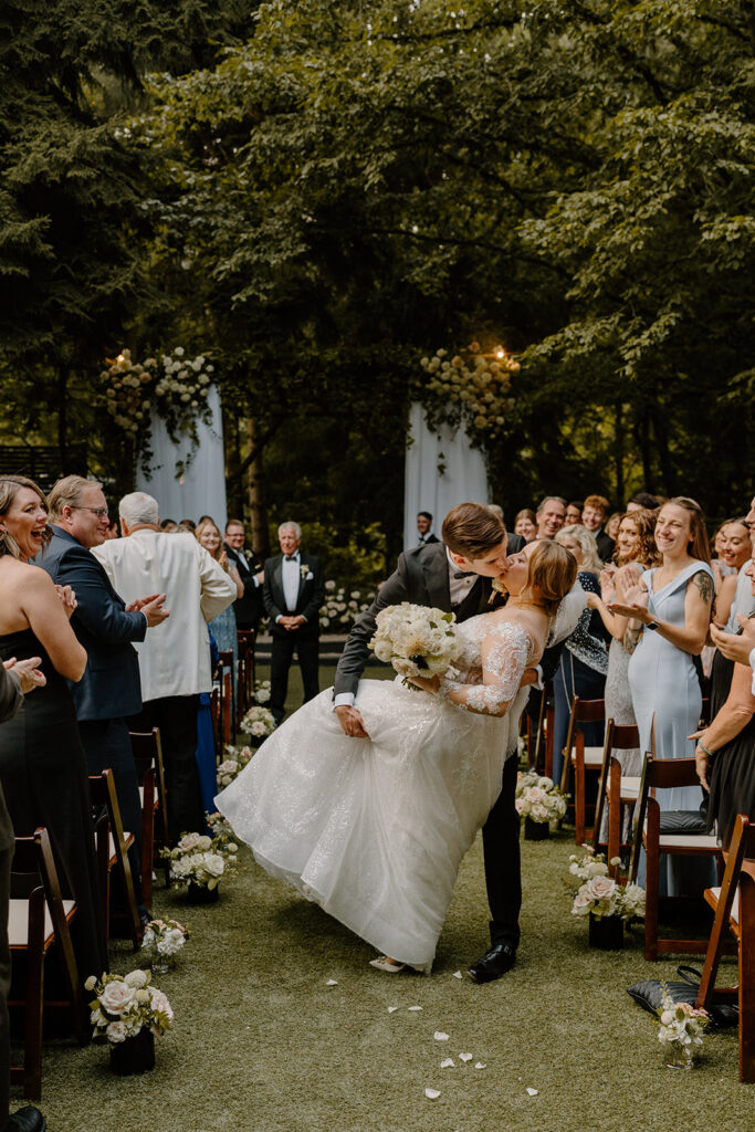 bride and groom first kiss what to pack on your wedding day